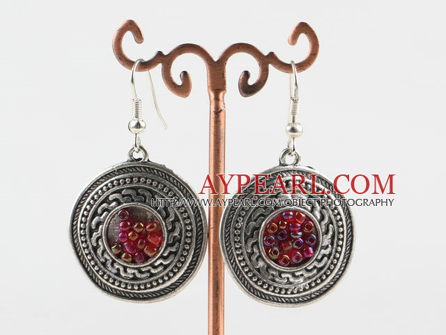 Lovely CCB silver like earrings with red beads in center