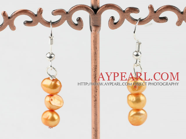 teints d'orange boucles d'oreilles perles