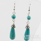 Boucles d'oreilles pendantes en argent tibet turquoise avec un charme