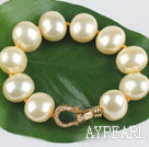 high quality egg shape light yellow sea shell beads bracelet with gold plated clasp