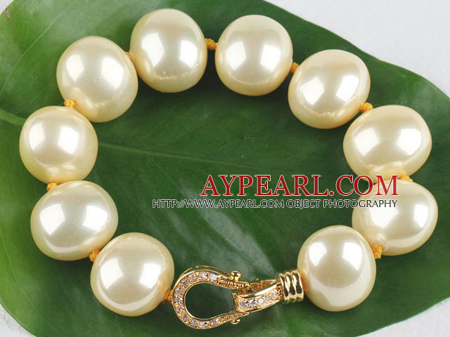 high quality egg shape light yellow sea shell beads bracelet with gold plated clasp