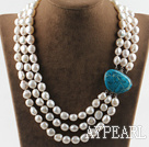 sparkly three strand white baroque pearl necklace with blue gem clasp