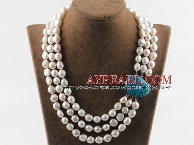 sparkly three strand white baroque pearl necklace with blue gem clasp