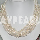 multi strand white pearl necklace with moonlight clasp