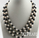 three strand white pearl and black agate necklace with shell flower clasp