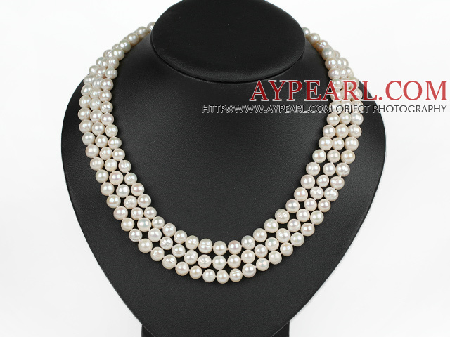 graceful three strand white pearl necklace with gold color clasp