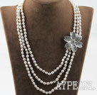 Three strand rice shape freshwater pearl necklace with flower accessories