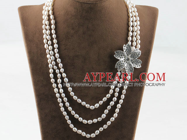 Three strand rice shape freshwater pearl necklace with flower accessories