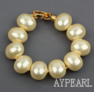 haute qualité de la lumière oeuf forme mer jaune shell perles bracelet avec fermoir plaqué or