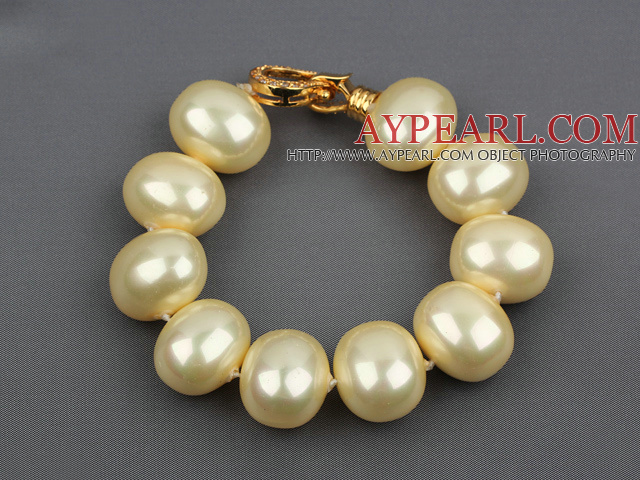 high quality egg shape light yellow sea shell beads bracelet with gold plated clasp