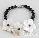 elegant black pearl and white shell flower bracelet with lobster clasp