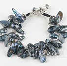 Two strand black teeth shape black pearl bracelet with toggle clasp