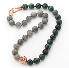 12mm Round Flash Stone and Zoisite Stone Beaded Knotted Necklace with Golden Rose Color Metal Ball