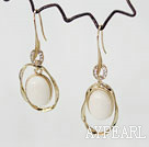metal jewelry big loop earrings with white beads in center