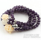 Faceted Amethyst Beaded Stretch Bracelet with Corozo Nut Buddha's Head and Rose Flower and Sterling Silver Fish Accessory ( Can also be Necklace )