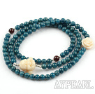 Cyanite Beaded Stretch Bracelet with Corozo Nut Buddha's Head and Rose Flower and Garnet and Sterling Silver Spacer Beads( Can also be Necklace )