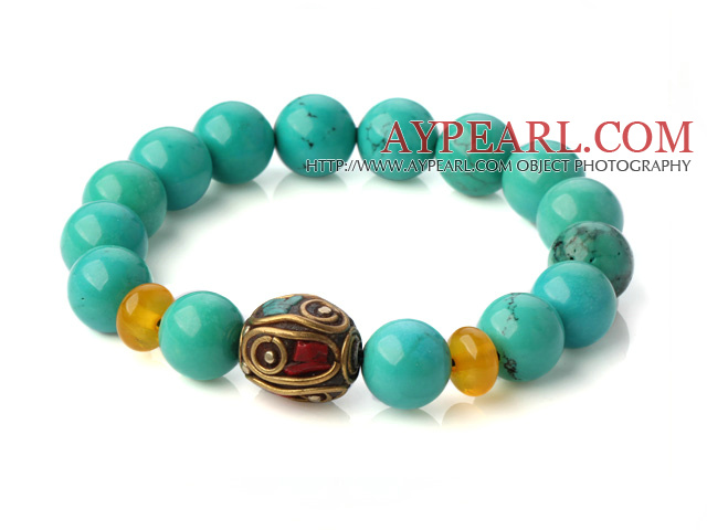 Popular Xinjiang Green Turquoise And Beeswax Beads Stretch Bracelet With Tibetan Charm