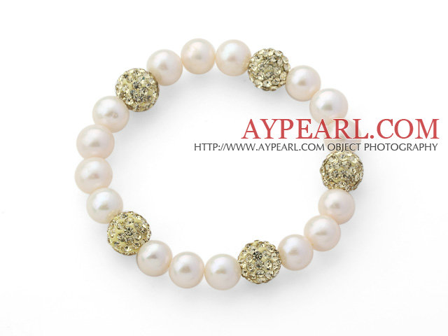 Une perle d'eau douce blanche ronde grade et lumière de couleur jaune boule de Rhinestone stretch perlée Bracelet