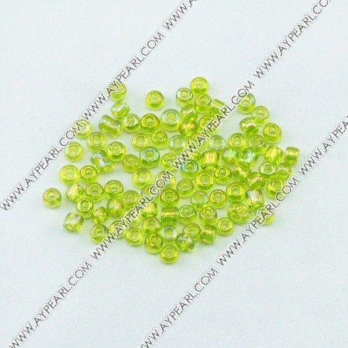 Glass seed beads,transparent rainbow olivine , 2*2.5mm round. Sold per pkg of 450 grams.