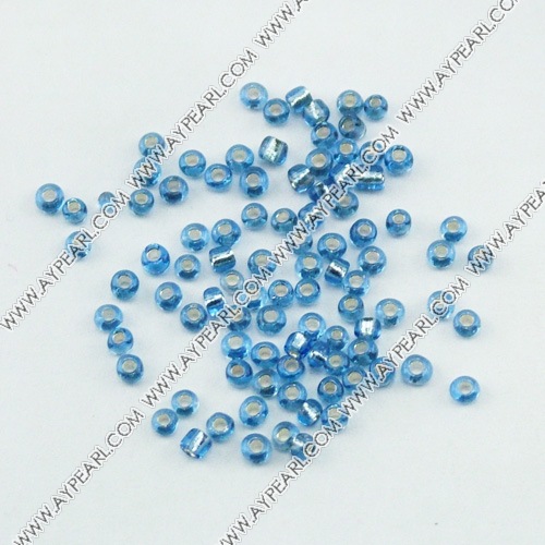 Glass seed beads, silver-lined blue , 2.5mm round. Sold per pkg of 450 grams.
