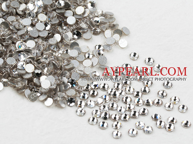 Rhinestone cabochon, white, silver-foil back ,3.0-3.2mm faceted round, SS12. Sold per pkg of 1440.