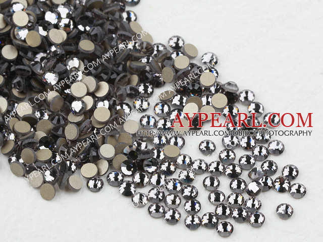 Rhinestone cabochon, transparent black, silver-foil back ,3.0-3.2mm faceted round, SS12. Sold per pkg of 1440.