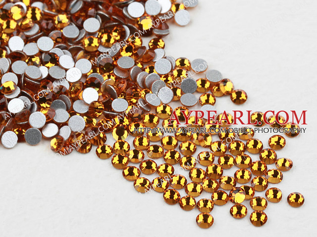 Rhinestone cabochon, golden, silver-foil back ,3.0-3.2mm faceted round, SS12. Sold per pkg of 1440.