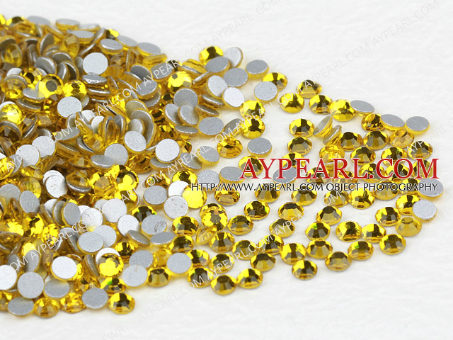 Rhinestone cabochon,lemon yellow, silver-foil back ,3.0-3.2mm faceted round, SS12. Sold per pkg of 1440.
