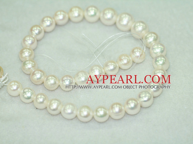 Freshwater pearl beads, white color, 12-14mm round. A grade. Sold per 15.7-inch strand.