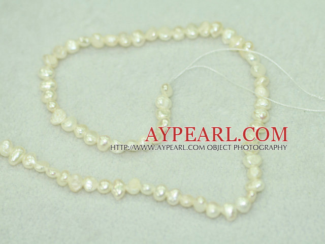 Freshwater pearl beads, dyed white, 5-6mm potato. Sold per 14-inch strand.