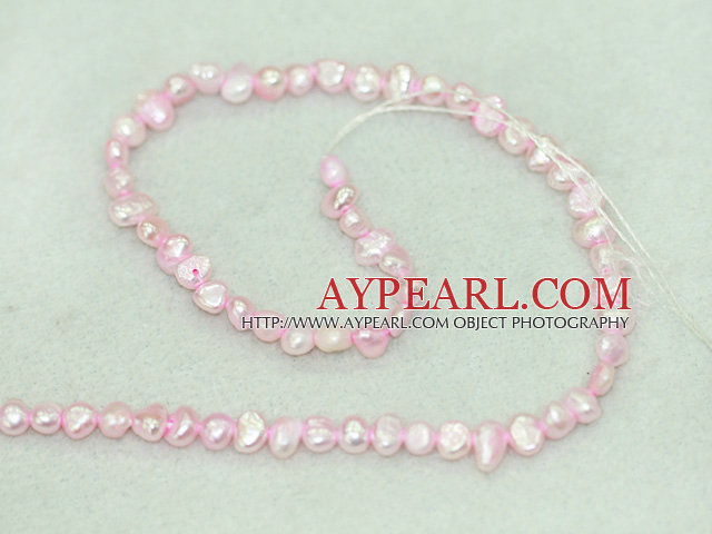 Freshwater pearl beads, dyed pink, 5-6mm potato. Sold per 14-inch strand.