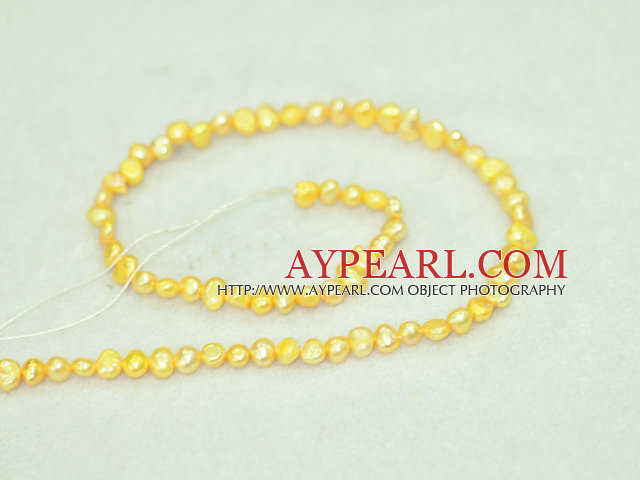 Freshwater pearl beads, dyed yellow, 5-6mm potato. Sold per 14-inch strand.