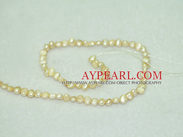 Freshwater pearl beads, dyed yellow, 5-6mm potato. Sold per 14-inch strand.