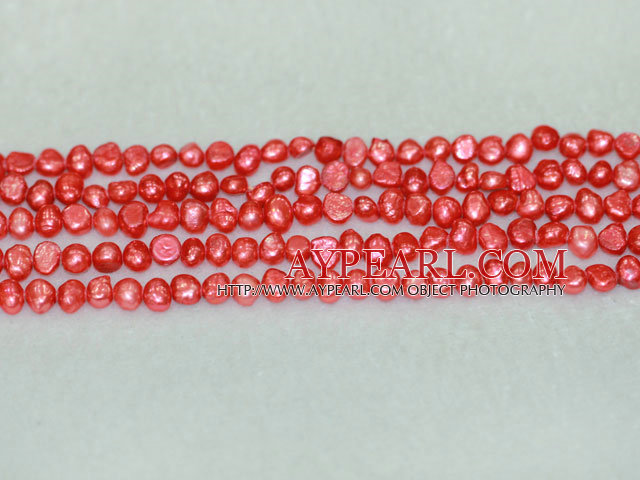 Freshwater pearl beads, dyed red, 5-6mm potato. Sold per 14-inch strand.