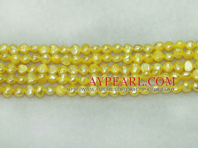 Freshwater pearl beads, dyed yellow, 5-6mm potato. Sold per 14-inch strand.